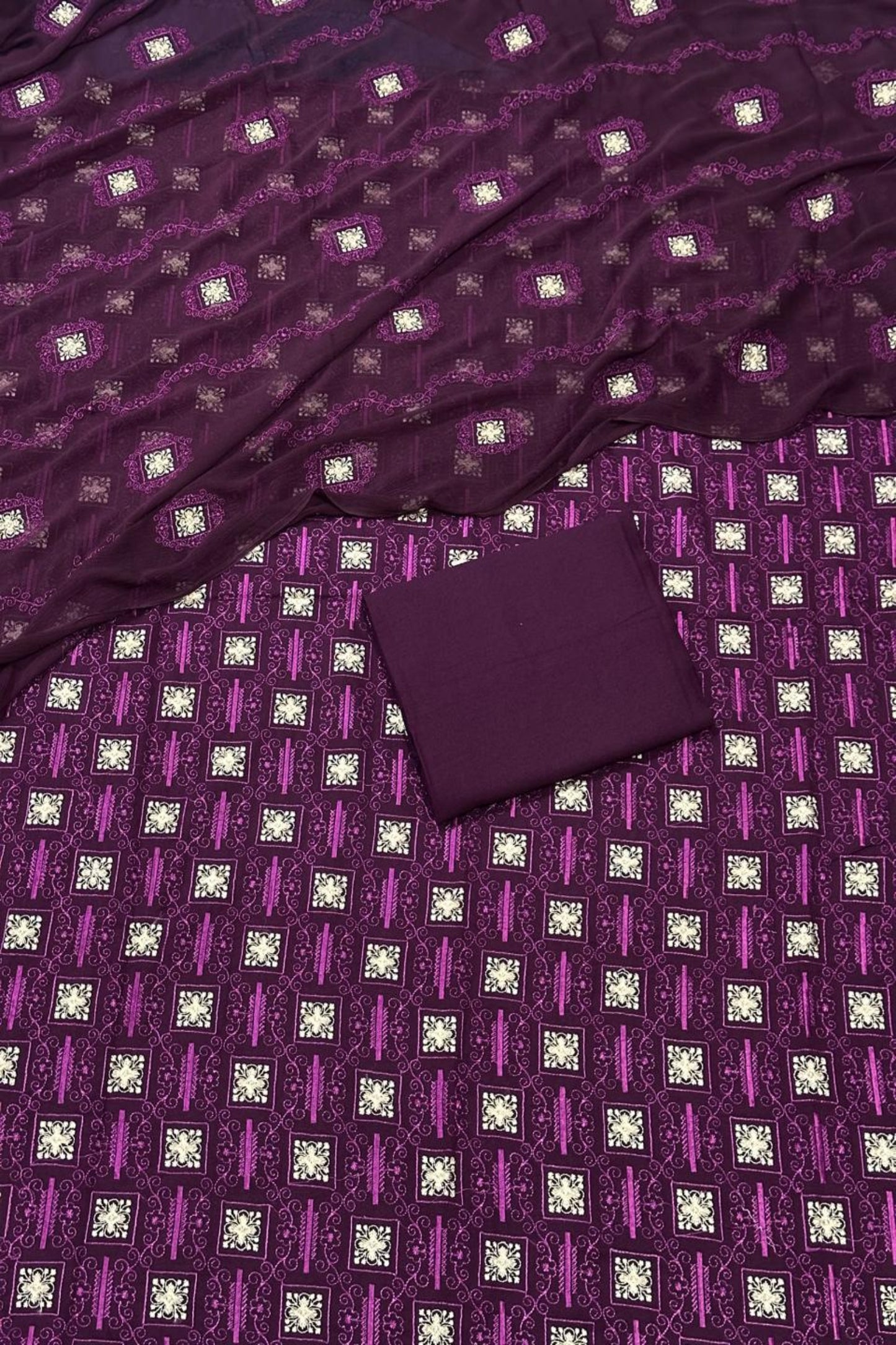 Purple fabric with a diamond pattern and a matching box on top