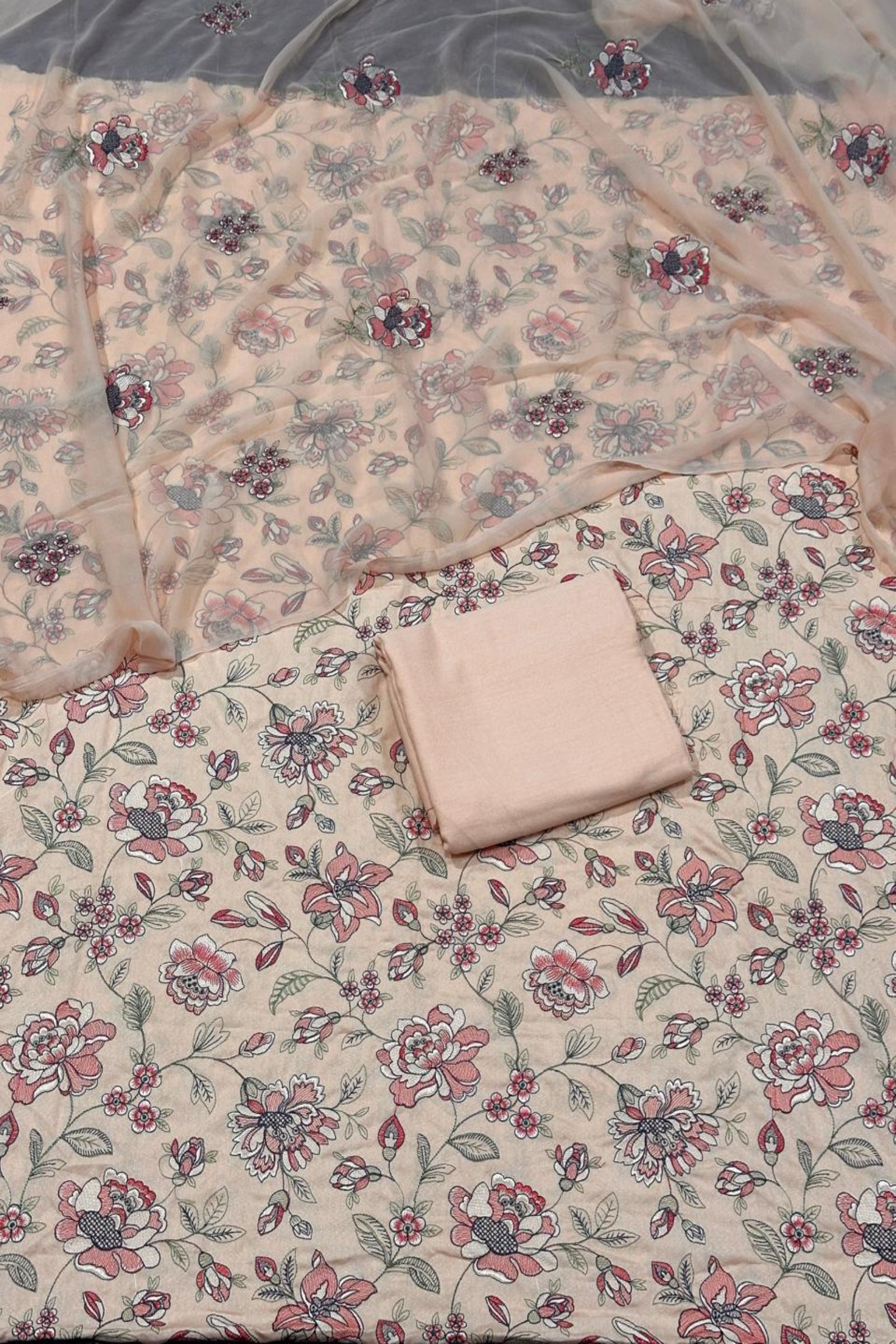 Floral patterned fabric with a folded piece of fabric on top