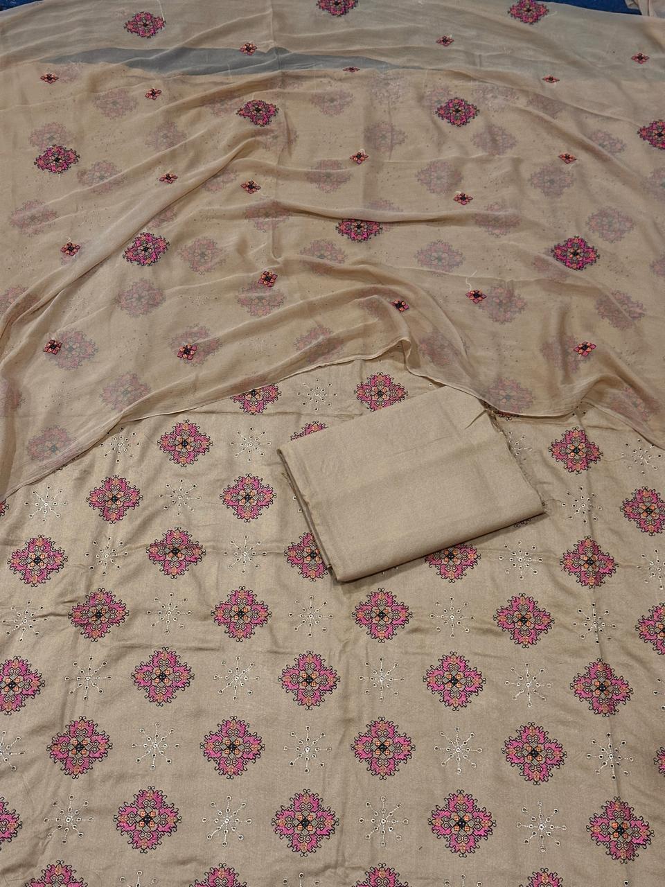 Beige fabric with pink floral patterns on a blue background