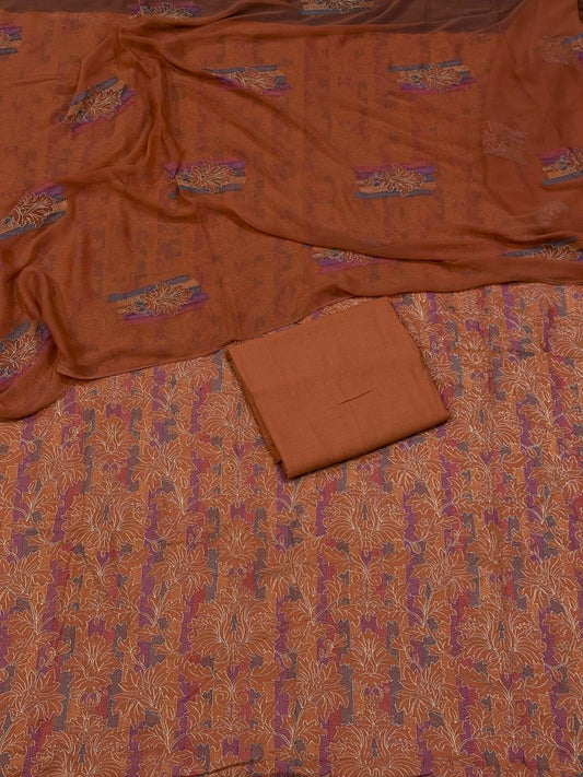 Brown fabric with intricate patterns on a matching brown background