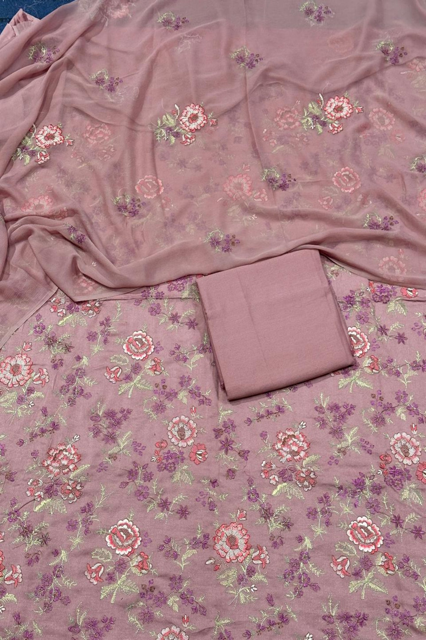 Floral patterned fabric with a folded piece of fabric on top