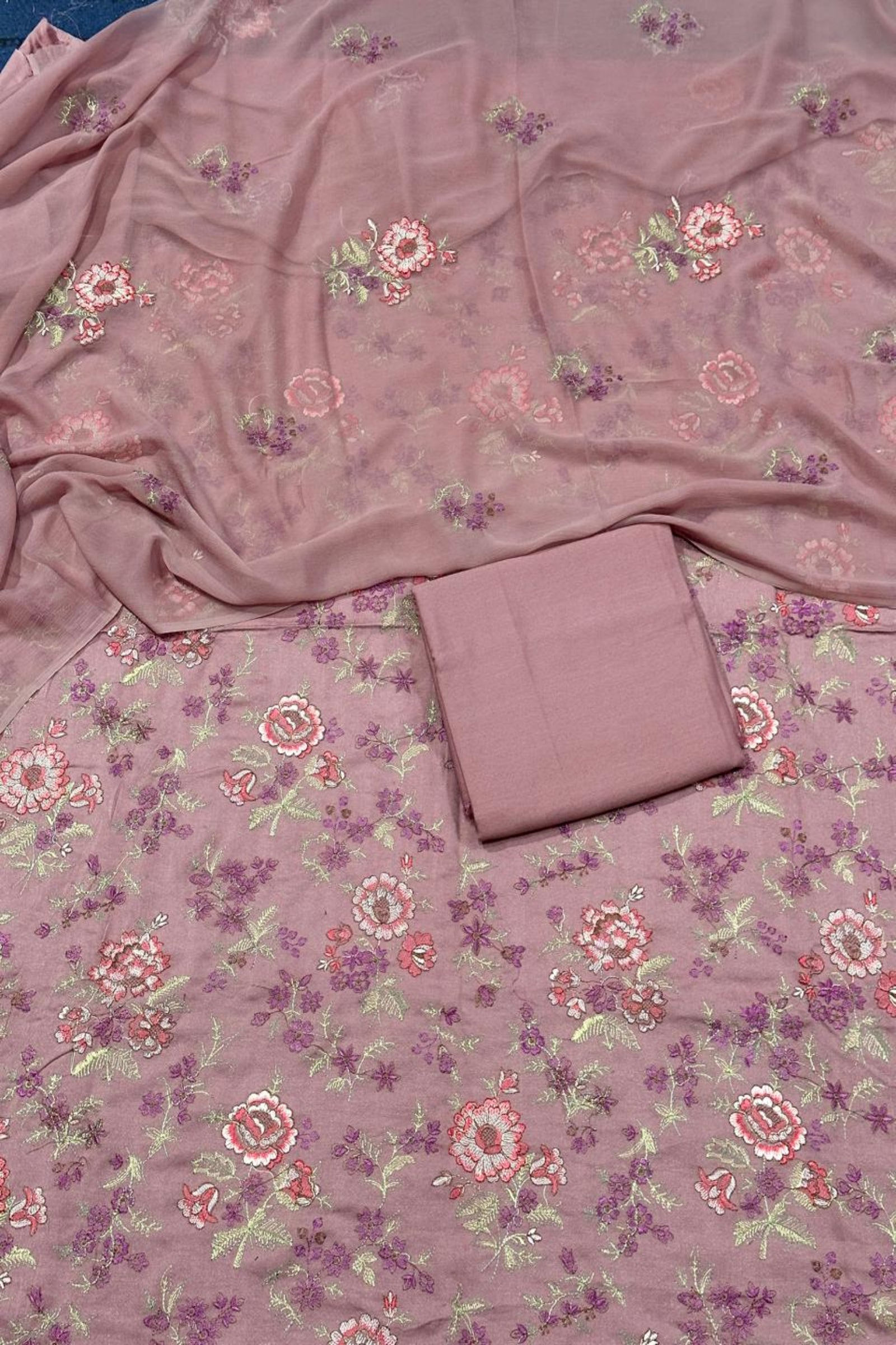 Floral patterned fabric with a folded piece of fabric on top