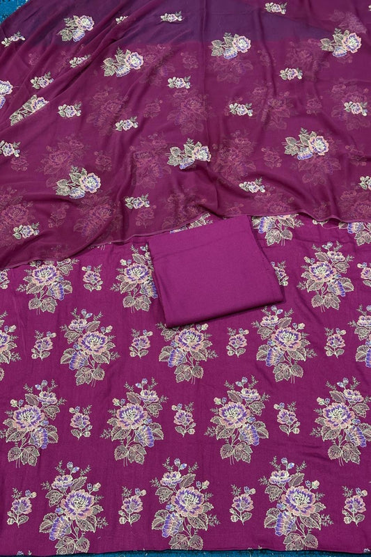 Purple fabric with floral patterns and a matching pouch on a blue background