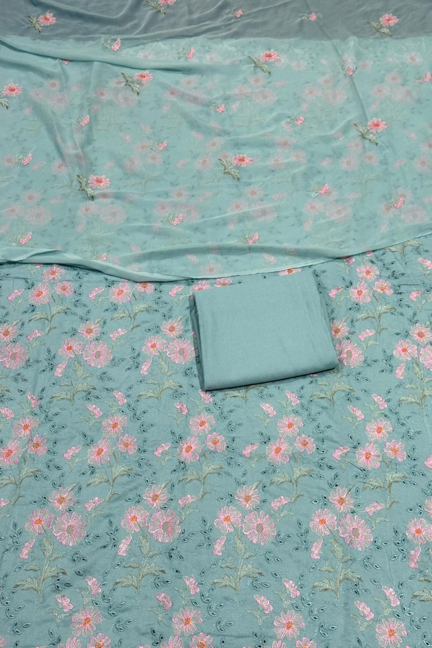 Floral patterned fabric with a folded piece of fabric on top