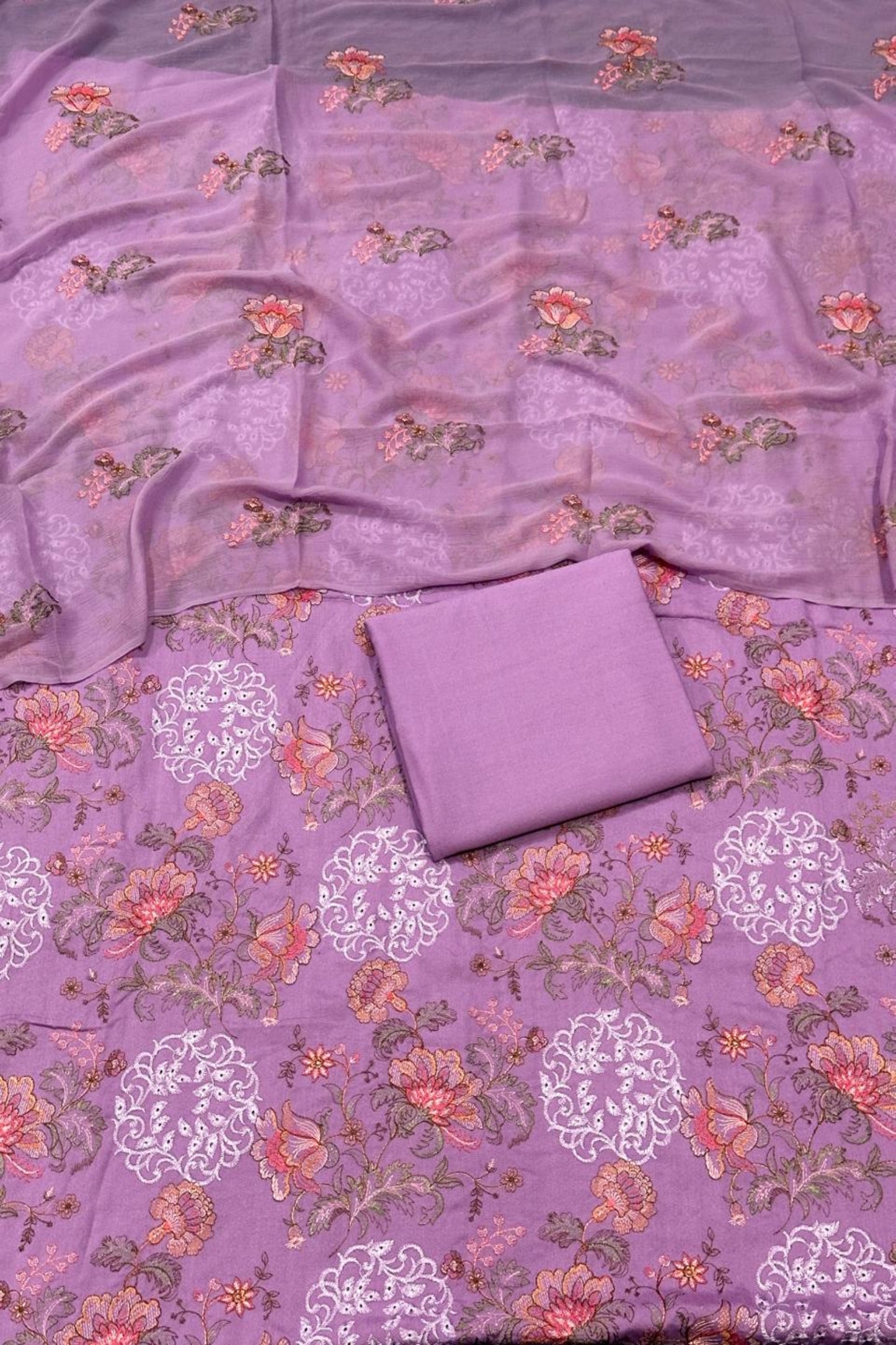 Purple fabric with floral patterns on a matching background