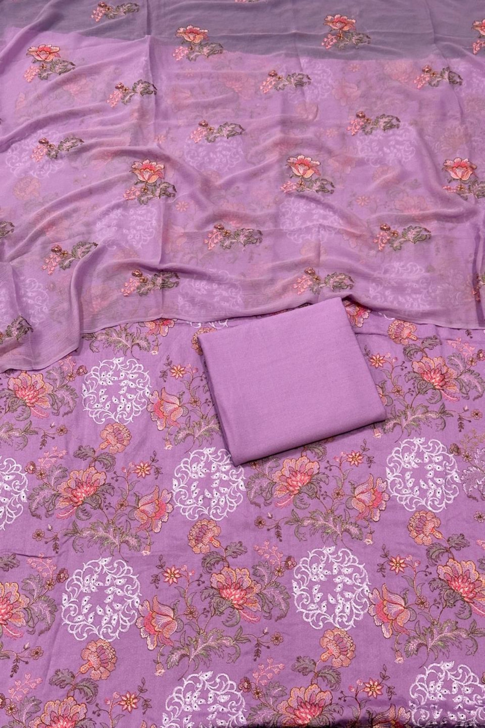 Purple fabric with floral patterns on a matching background