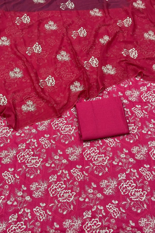 Red fabric with white floral patterns, folded and displayed.