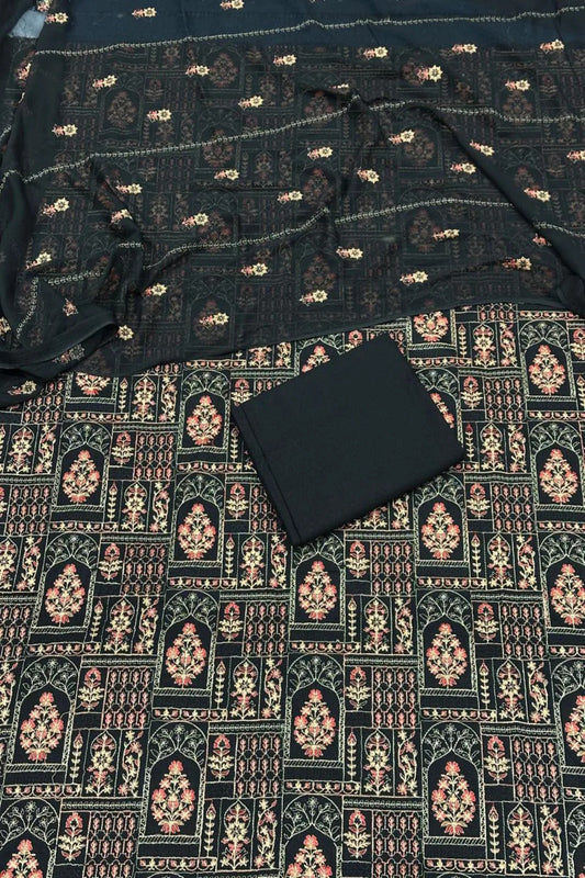 Black fabric with intricate patterns on a dark background