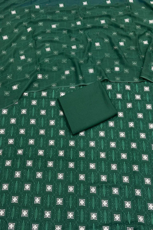 Green fabric with a subtle pattern on a flat surface