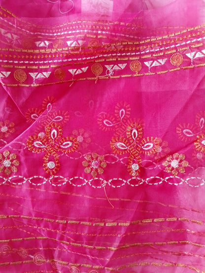 Pink fabric with intricate gold and red embroidery
