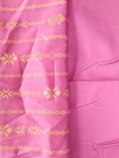 Pink fabric with gold embroidery patterns
