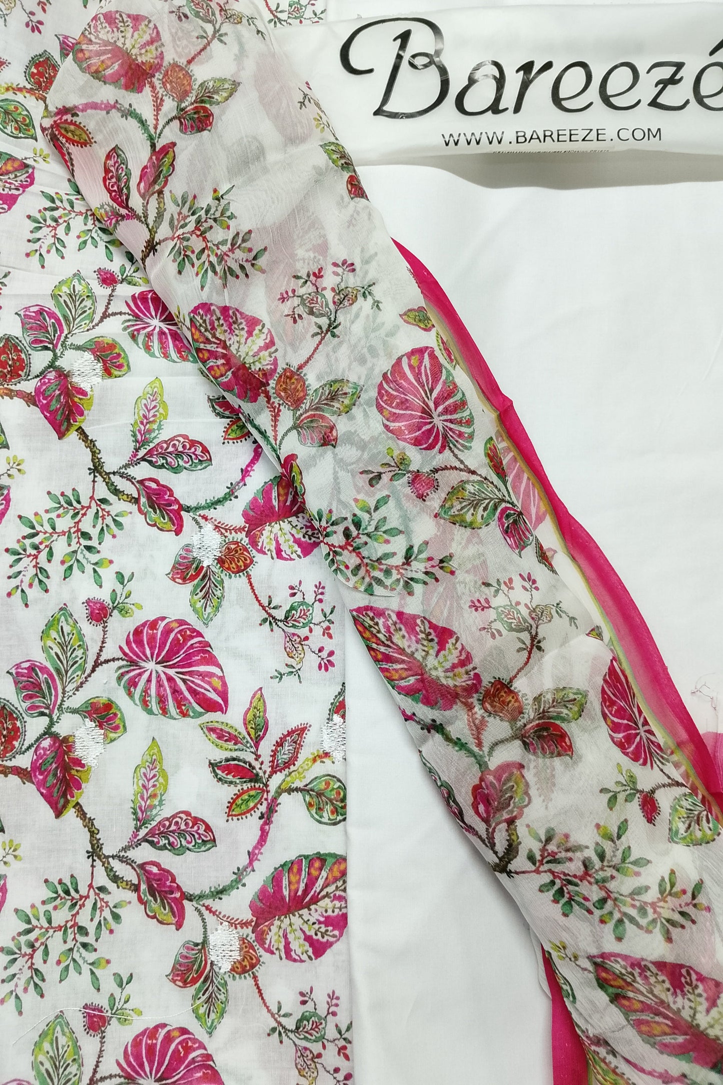 Floral fabric with pink and green patterns on a white background, featuring the Bareeze brand.