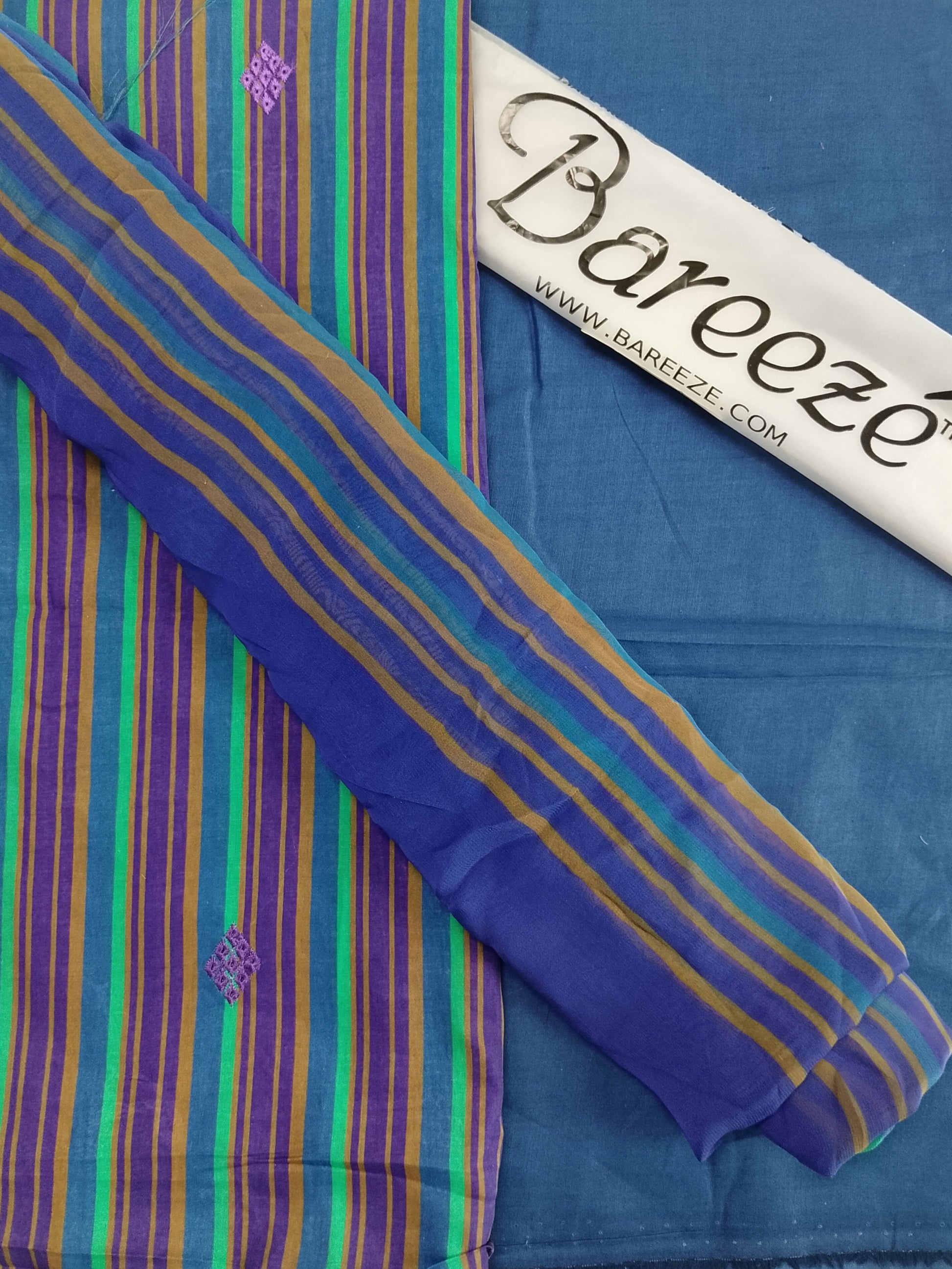 Striped fabric with a Bareeeze tag on a blue background