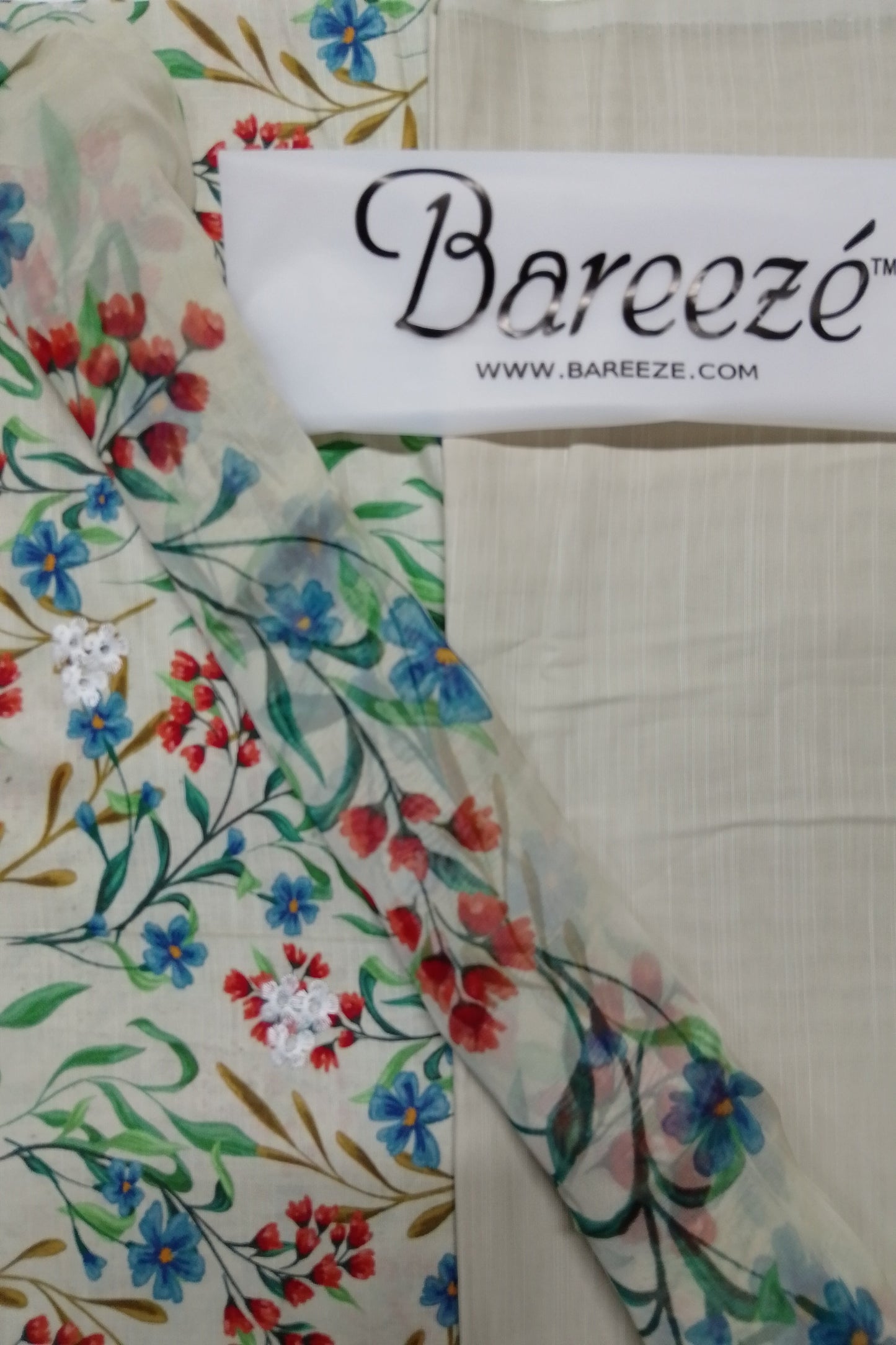 Floral fabric with Bareezé label on a white background