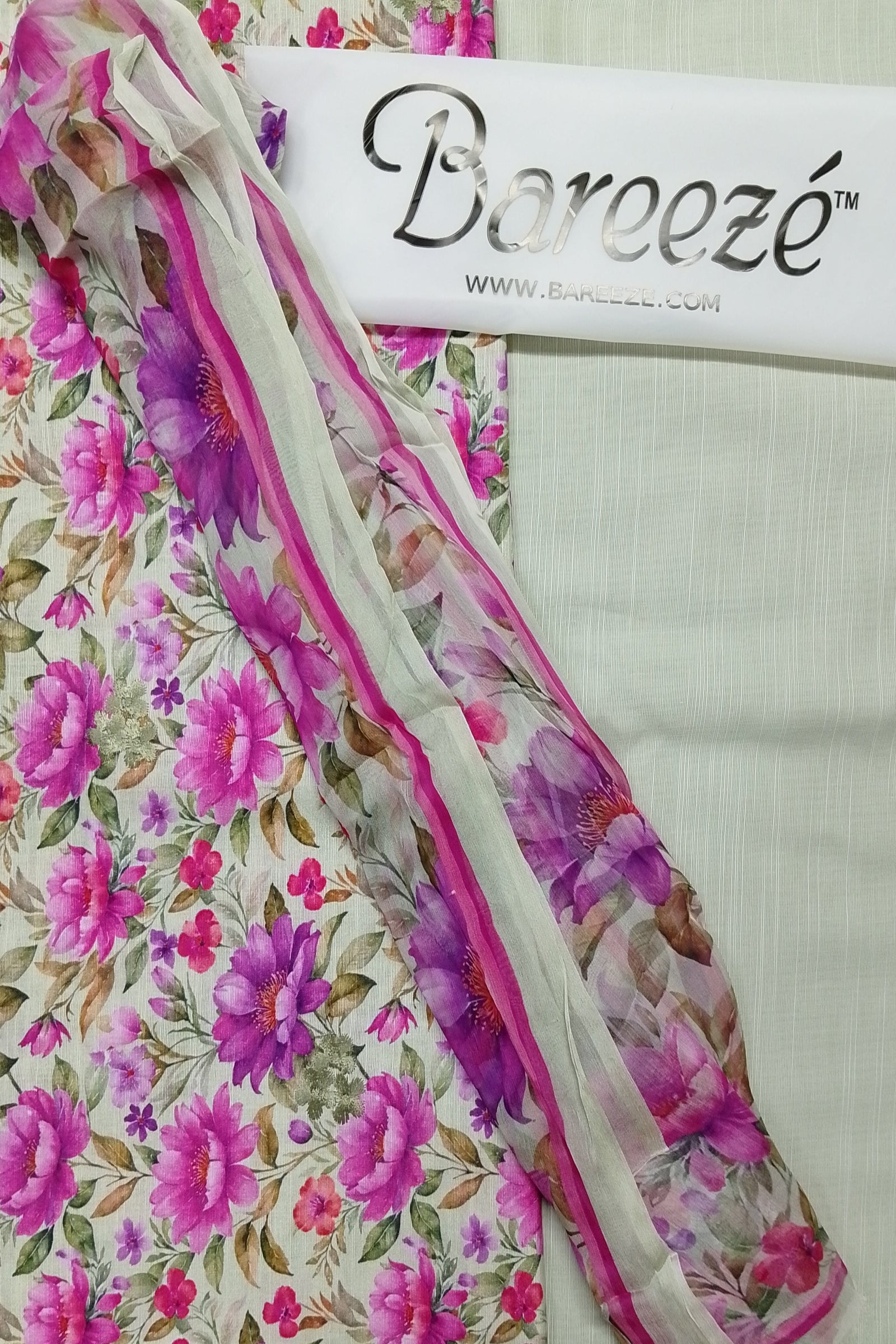Floral fabric with pink and purple flowers on a white background, featuring the Bareeze brand.