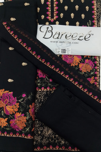 Black fabric with colorful floral embroidery and Bareeze label