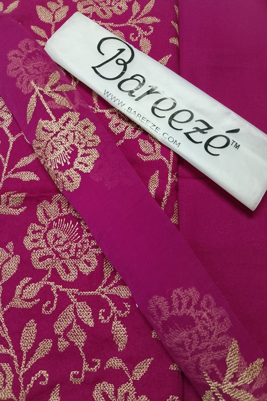 Pink fabric with gold floral patterns and a Barveze label on top.