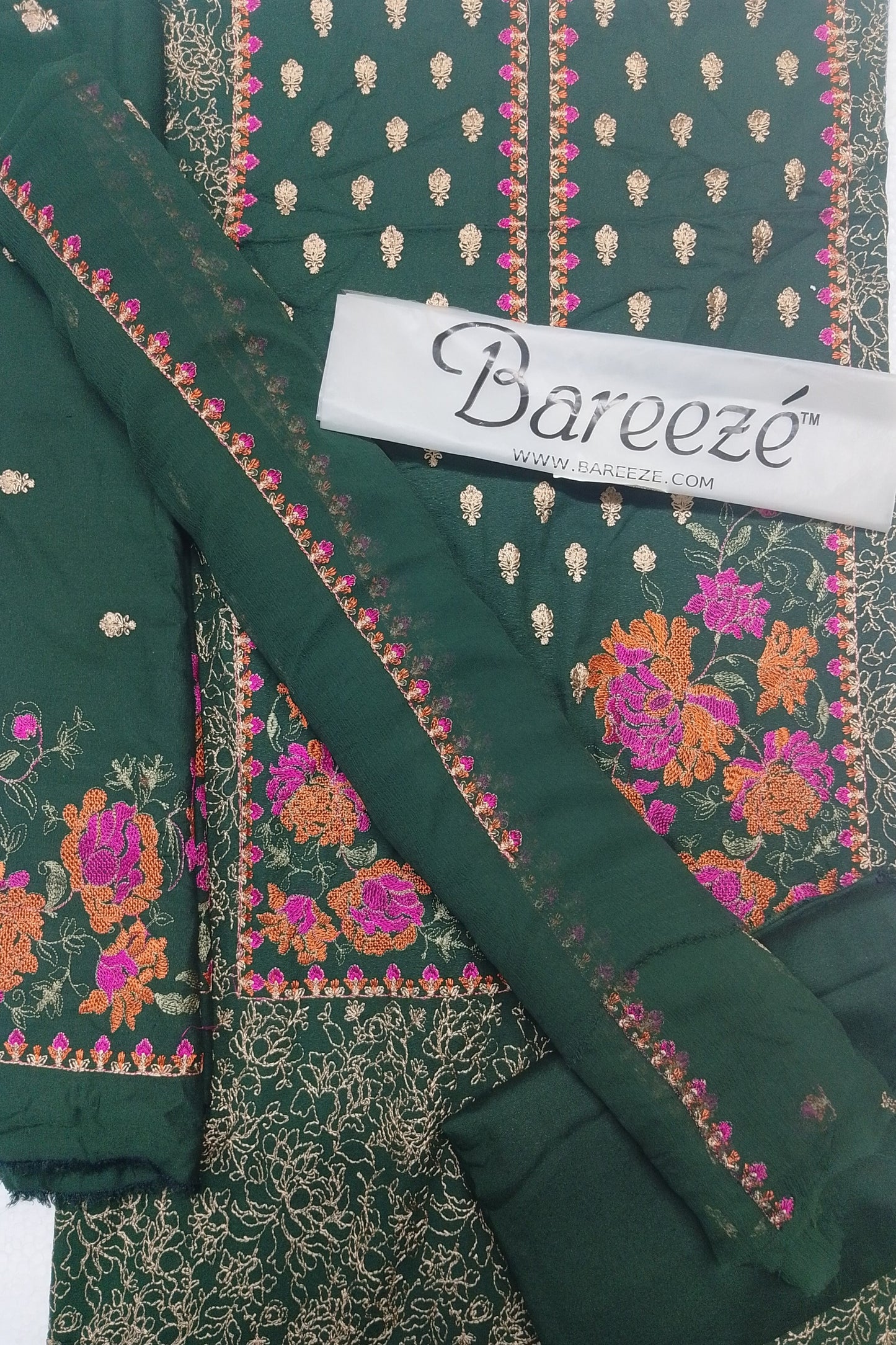 Green embroidered fabric with floral patterns and Bareeze label