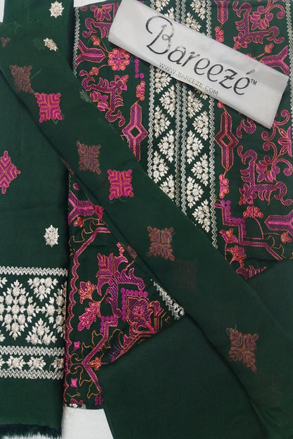 Green fabric with intricate patterns and a Bareeze label.