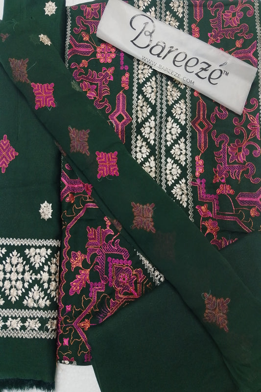 Green fabric with intricate patterns and a Bareeze label.