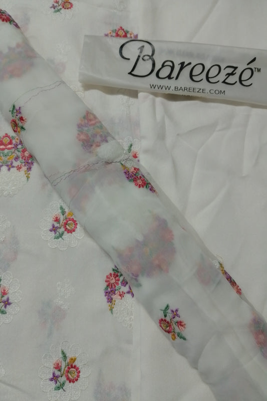 Floral embroidered fabric with Bareezé label