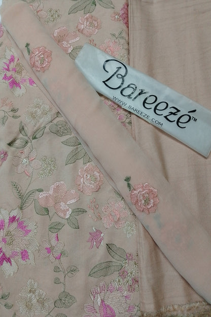 Floral embroidered fabric with a Bareezé label on a floral background