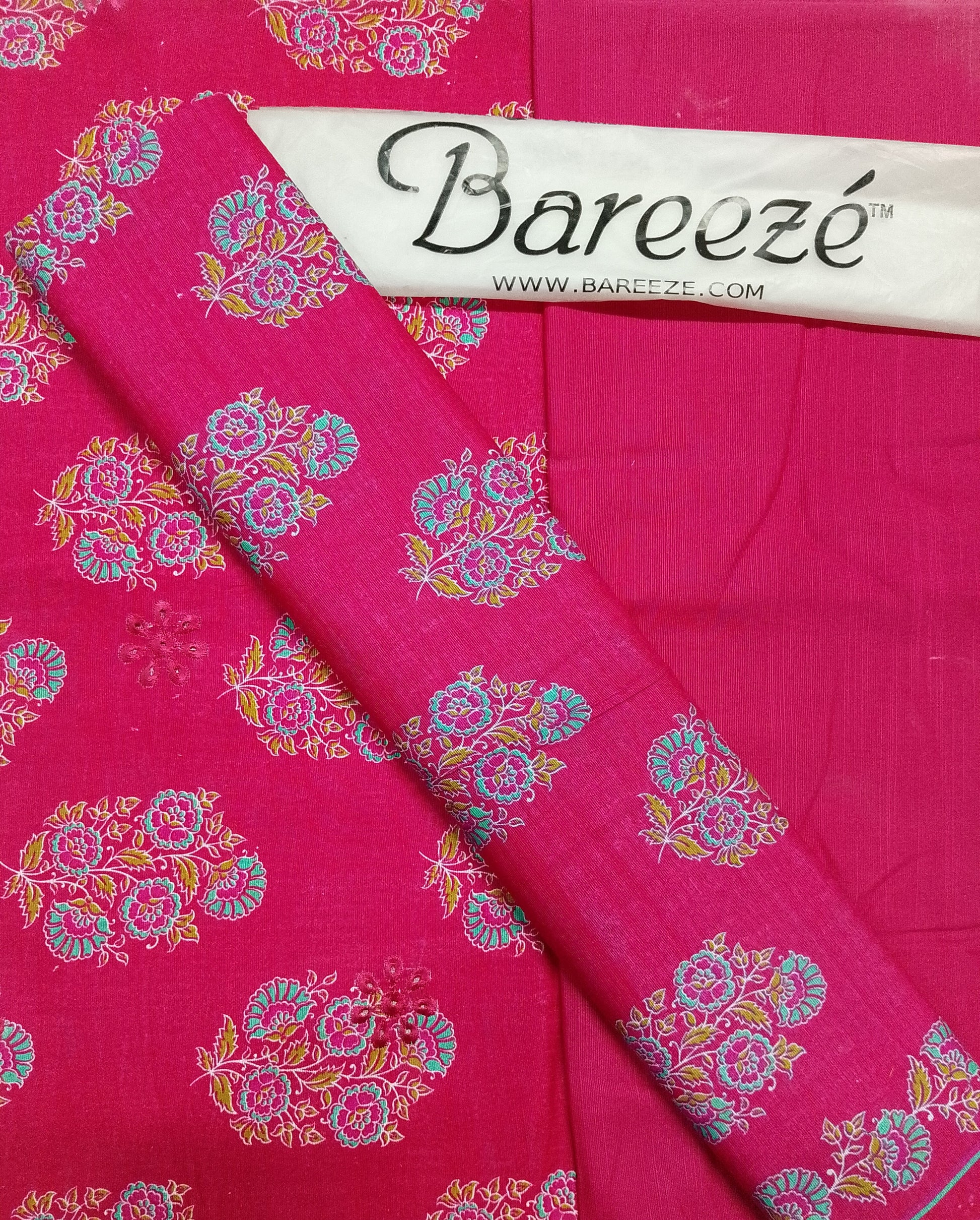 Pink fabric with floral patterns and Bareeze branding