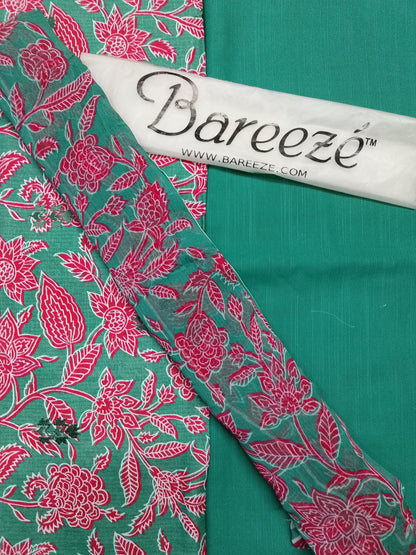 Green fabric with pink floral pattern and Bareeze branding