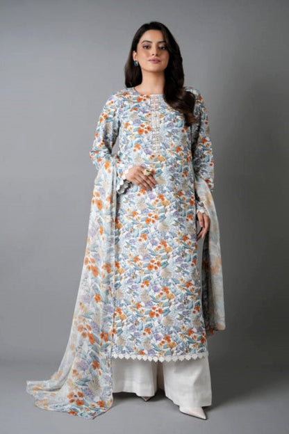 Woman wearing a floral dress with a plain drape against a gray background