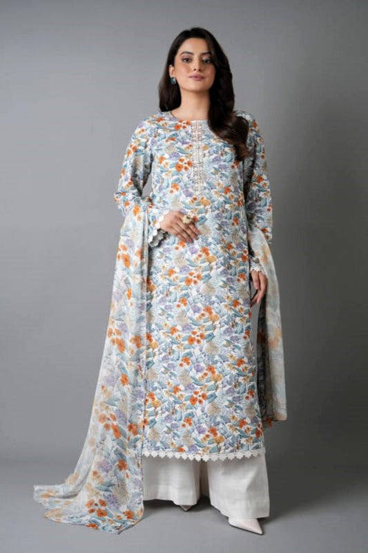 Woman wearing a floral dress with a plain drape against a gray background