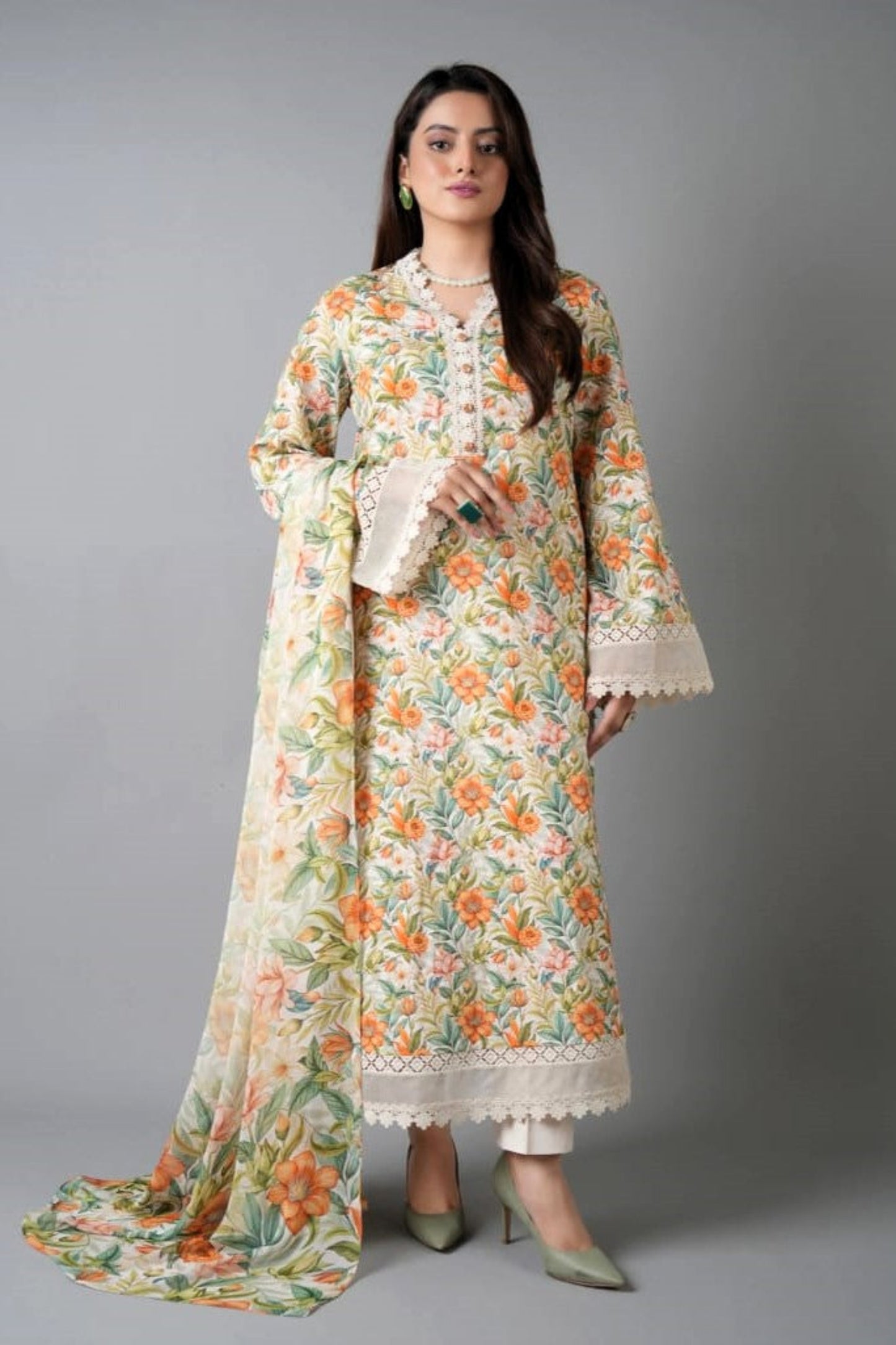 Woman wearing a floral dress with a plain background