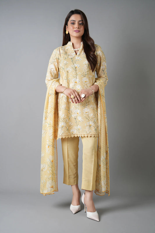 Woman wearing a yellow traditional outfit with a plain background