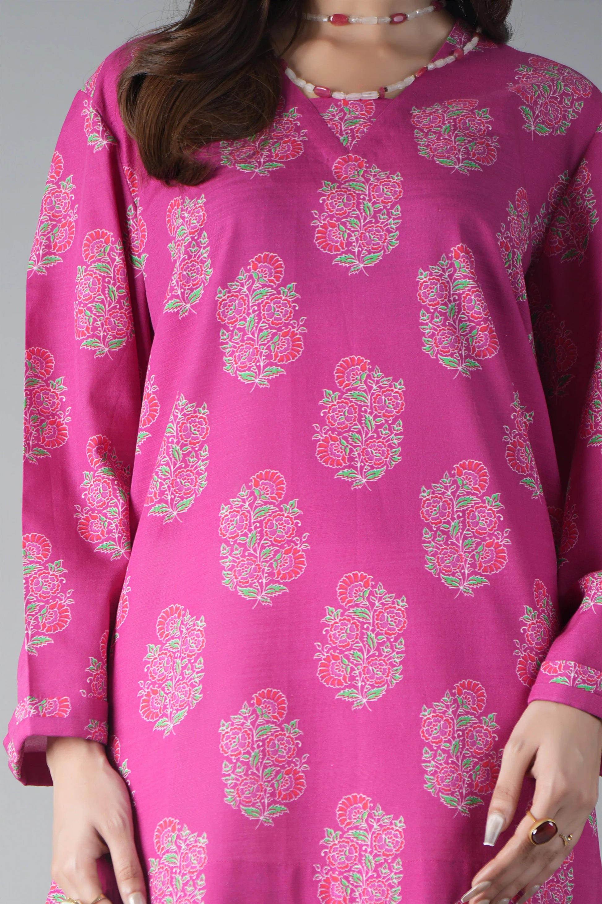 Pink floral patterned kurta worn by a person