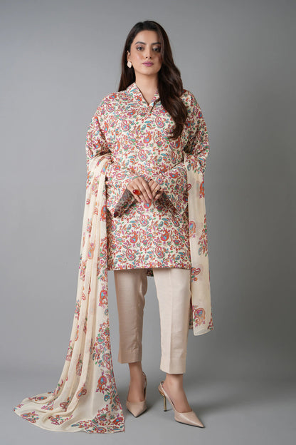 Woman wearing a floral outfit with beige pants and a matching dupatta on a gray background